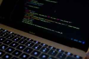 MacBook Pro with images of computer language codes